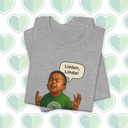 Gray t-shirt with a graphic of a child and 'Listen, Linda!' text on a heart-patterned background