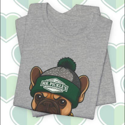 Gray t-shirt with a dog wearing a green beanie on a patterned background
