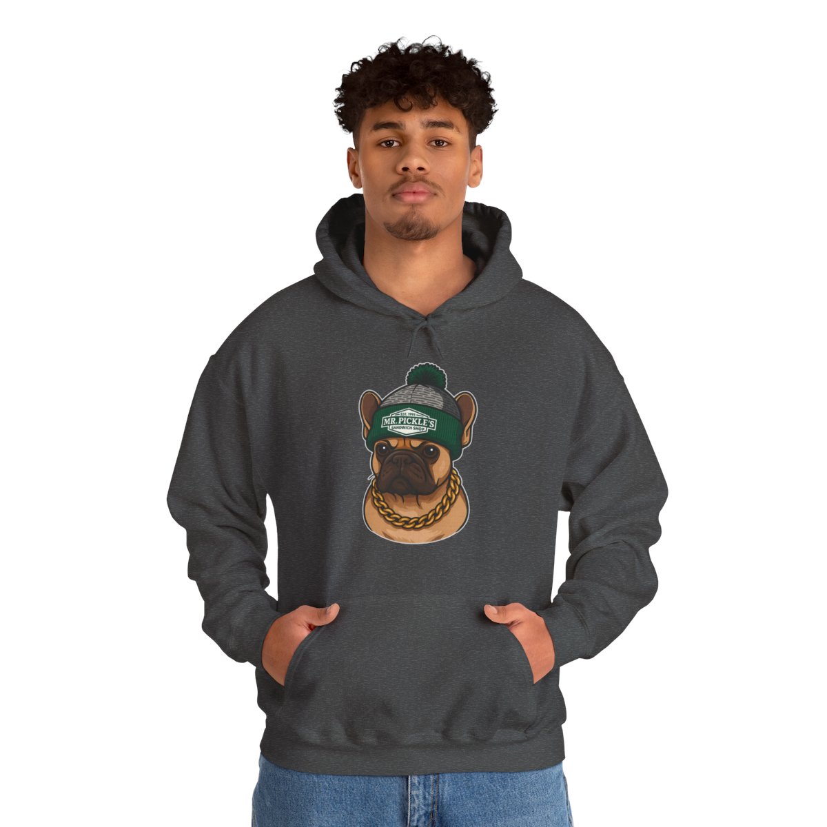 Person wearing a dark gray hoodie with a graphic of a dog wearing a green cap on a white background