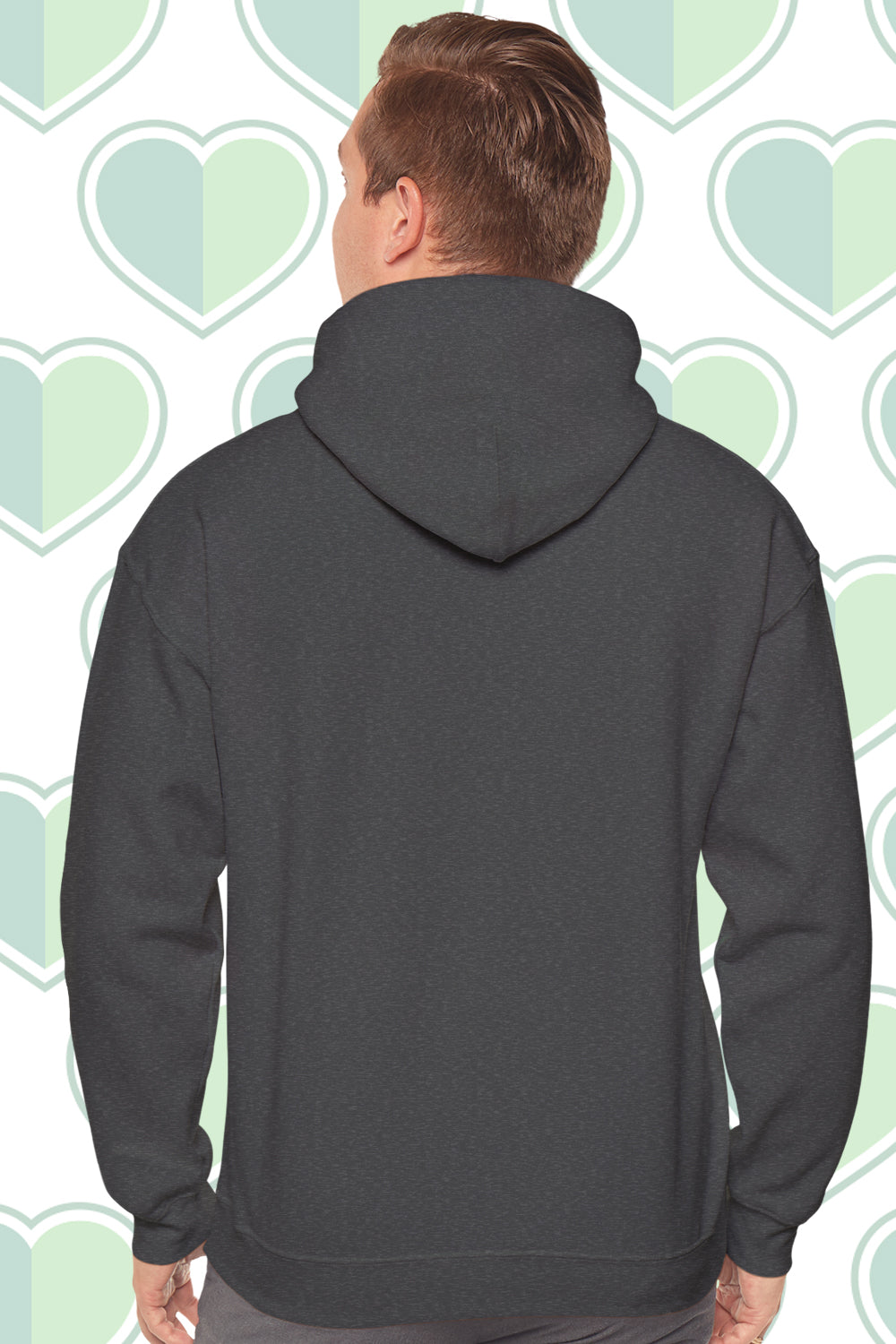 Person wearing a gray hoodie with a heart-patterned background