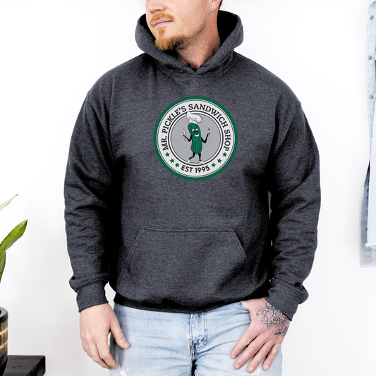 Person wearing a dark gray hoodie with a logo and text, standing against a white background.