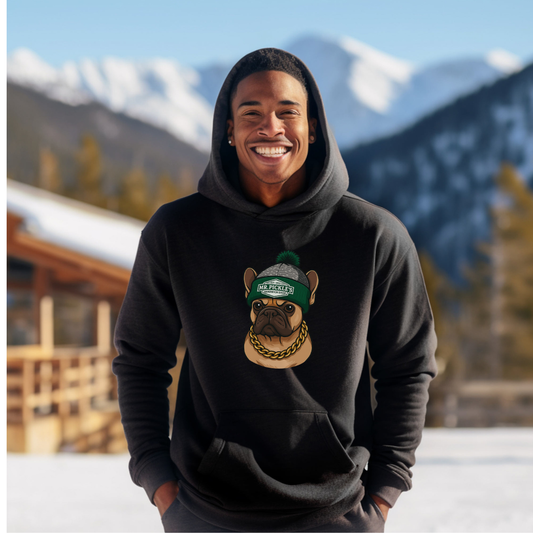 Person wearing a black hoodie with a dog graphic in a snowy mountain setting