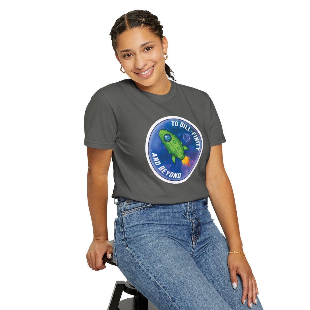 Person wearing a gray t-shirt with a graphic design on a white background