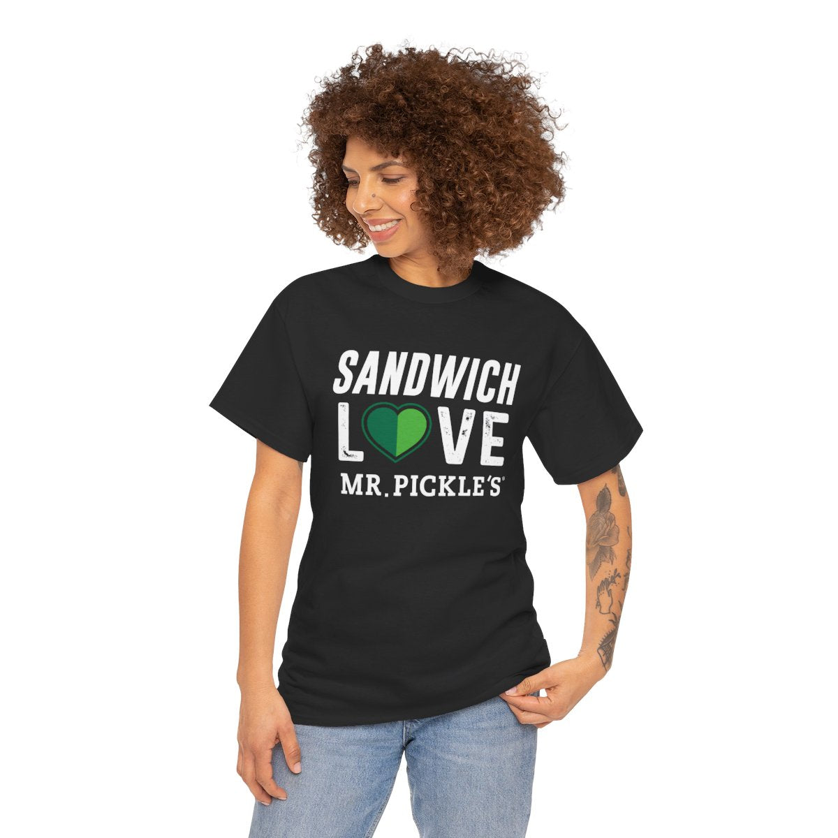Woman wearing a black t-shirt with 'Sandwich Love Mr. Pickle's' text and green heart design on a white background