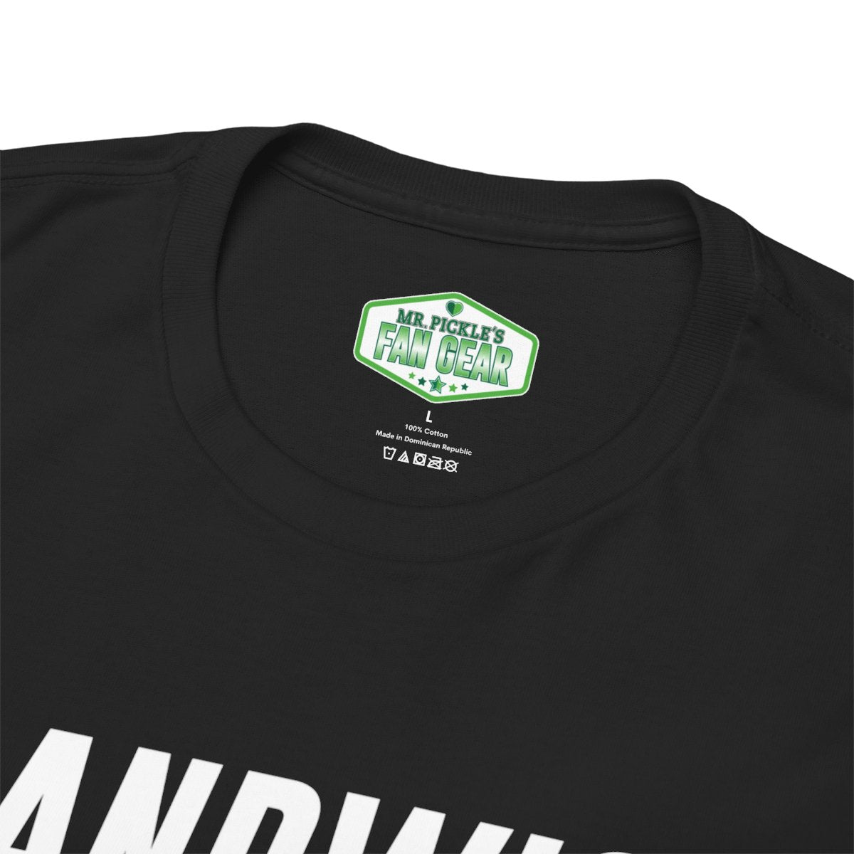 Black t-shirt with a green label on the collar