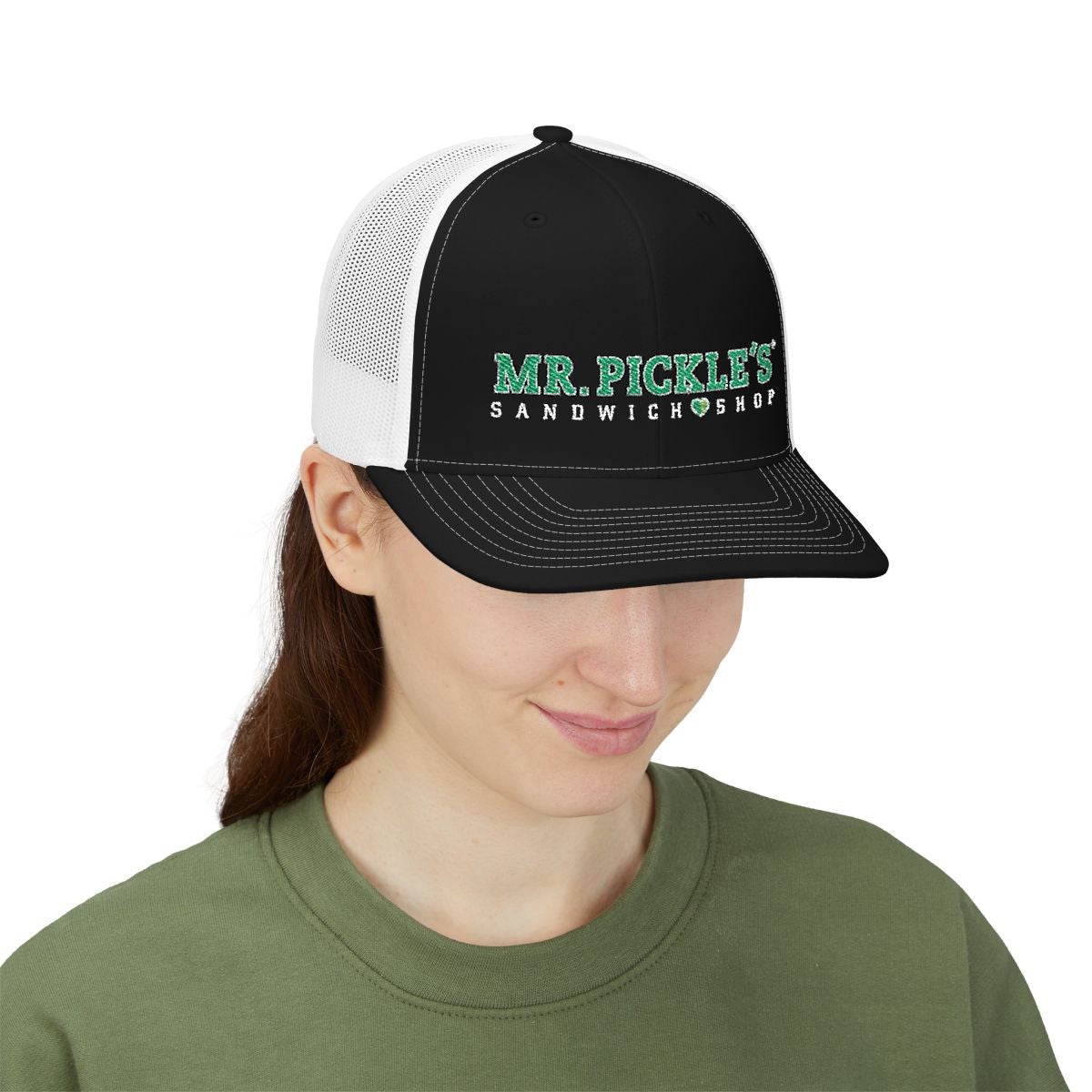 Person wearing a black and white cap with 'Mr. Pickle's Sandwich Shop' text on a white background