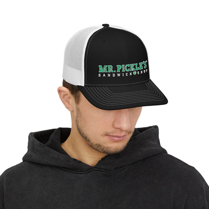 Man wearing a black and white cap with 'Mr. Pickle's Sandwich Shop' logo on a white background