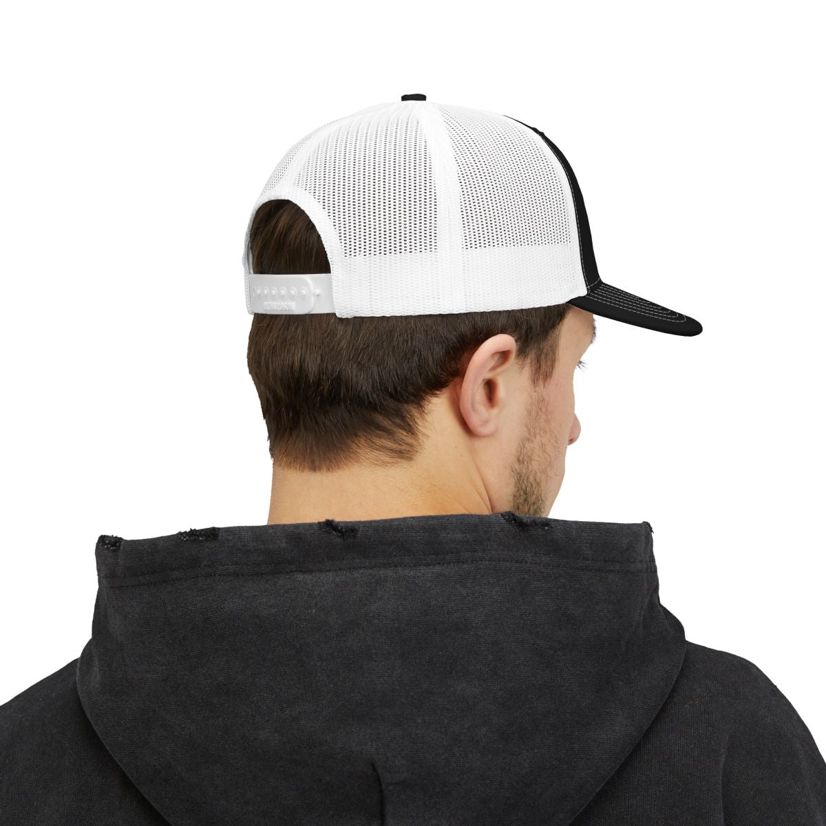 Person wearing a black and white cap from behind on a white background